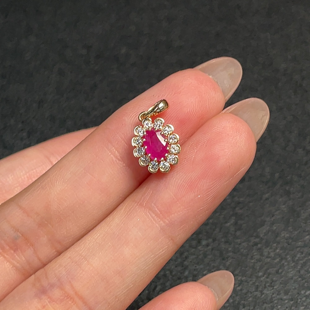 HUILIU HQ ruby pendant in 18K gold with diamond accents, showcasing a vibrant gemstone and elegant gold setting.