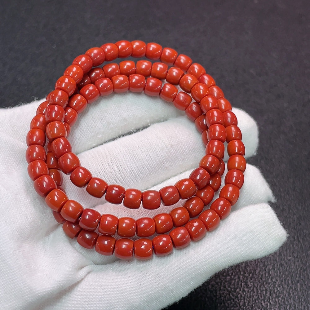 South Red Agate gemstone bead strand with visible organic matter, approximately 5.6mm, from HUILIU HQ certified gemstone collection.