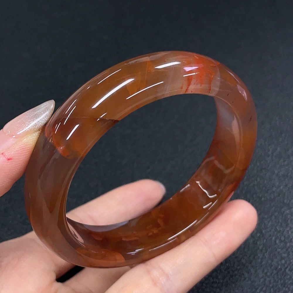 South Red Agate gemstone bracelet by HUILIU HQ featuring visible organic matter, showcasing natural gemstone beauty and craftsmanship.
