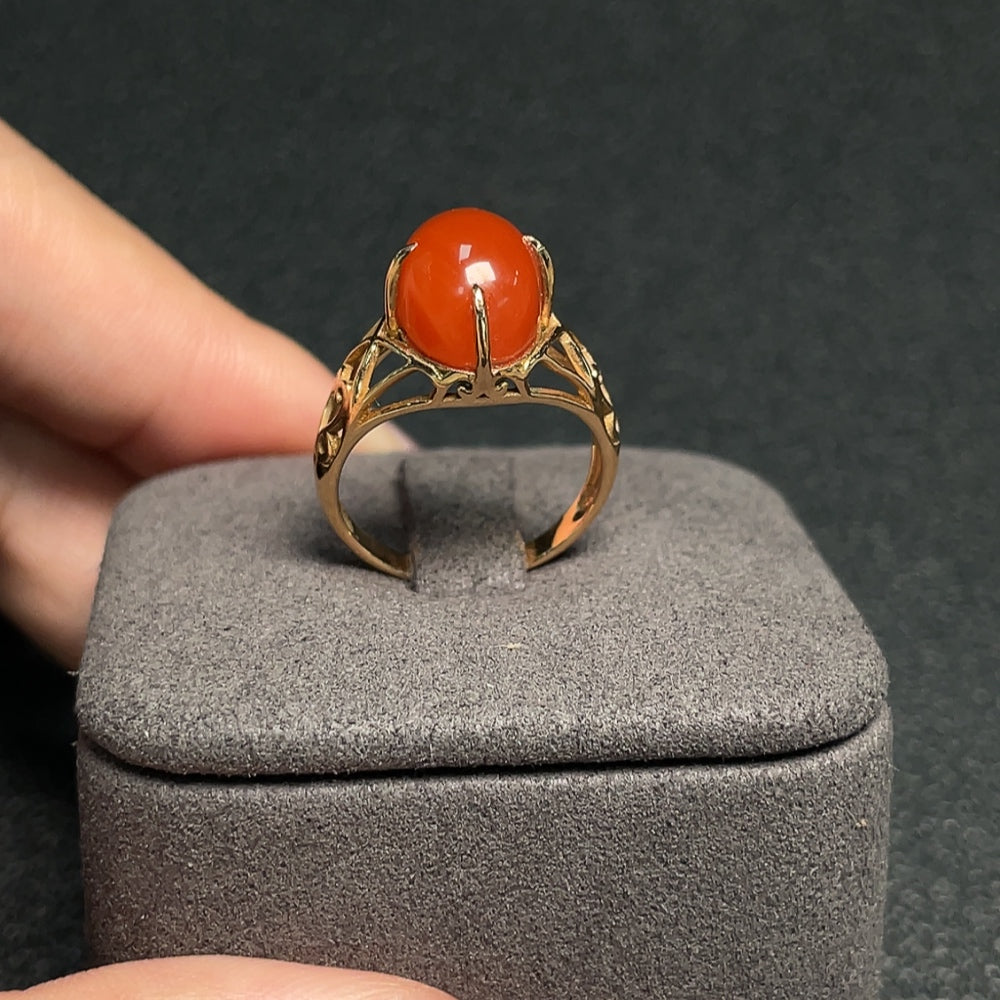 South Red Agate gemstone ring by HUILIU HQ featuring a polished red agate stone set in a stylish band.