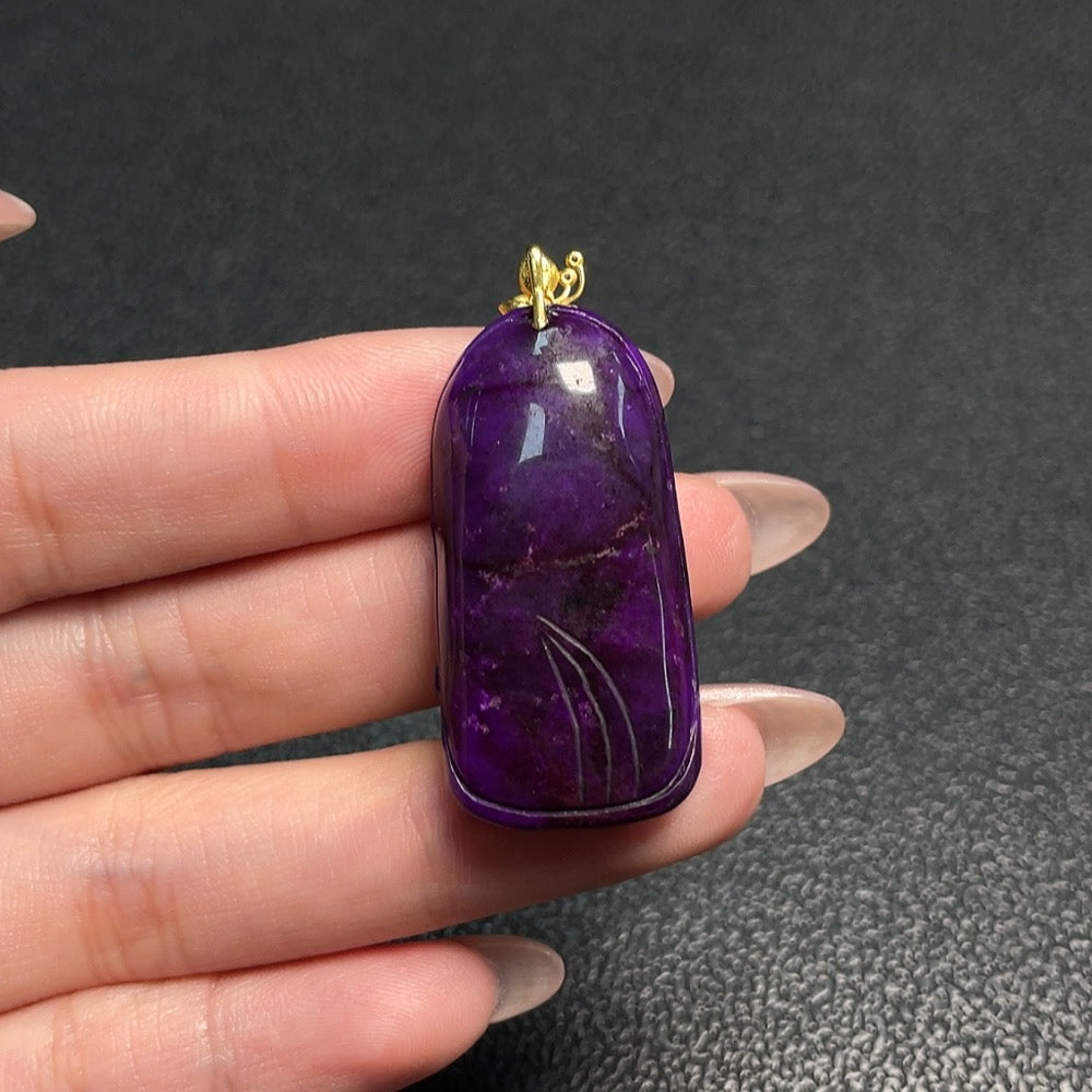 Huiliu Certified Sugilite gemstone pendant with mineral components and non-natural accent stones on a silver chain.