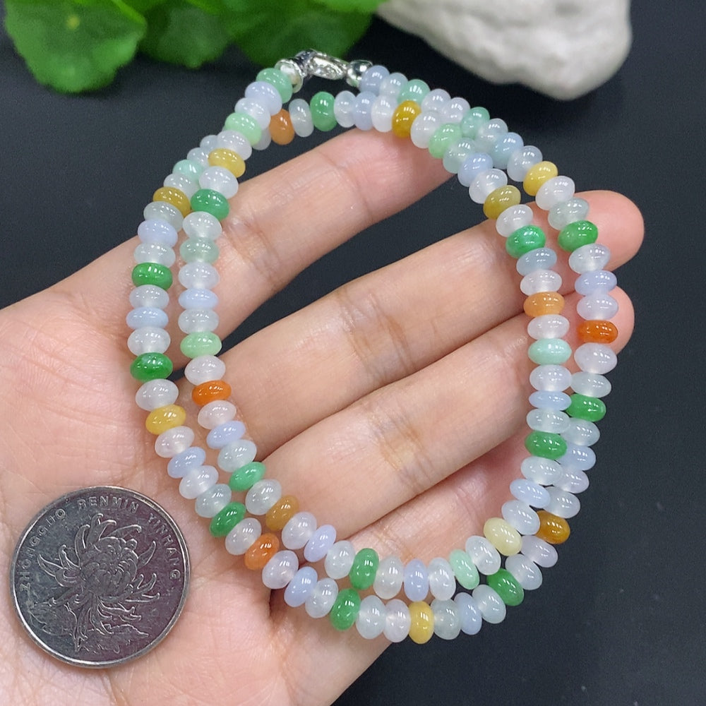 HUILIU HQ jade pendant with an undetermined color origin, showcasing smooth, polished green jade stone.