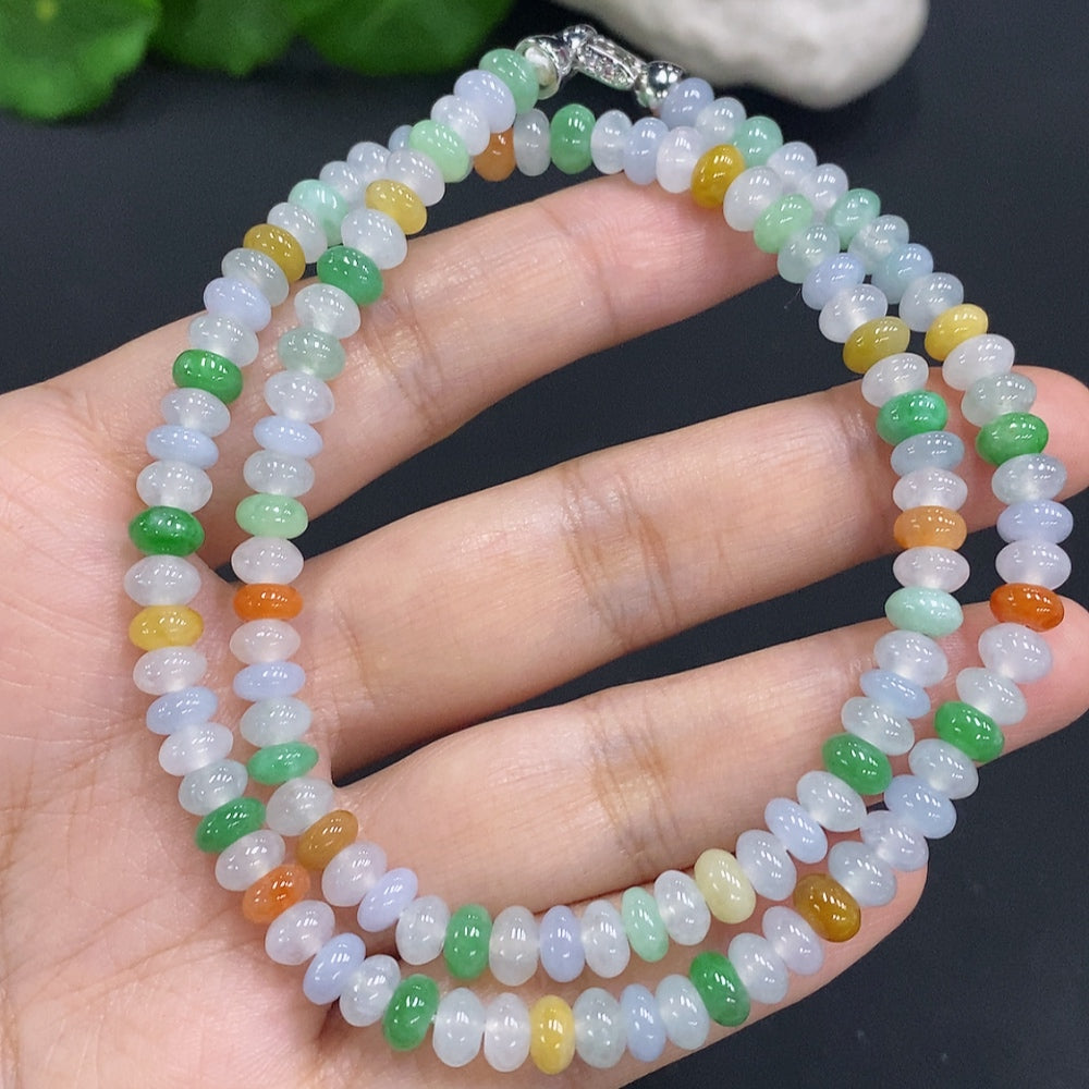 HUILIU HQ Jade gemstone with an undetermined color origin, showcasing a smooth polished surface and natural stone appearance.