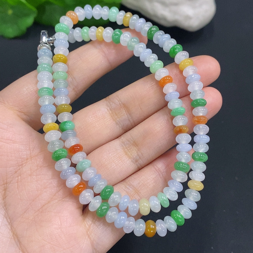 HUILIU HQ Jade gemstone with an undetermined color origin, showcasing a smooth, polished surface with natural green hues.
