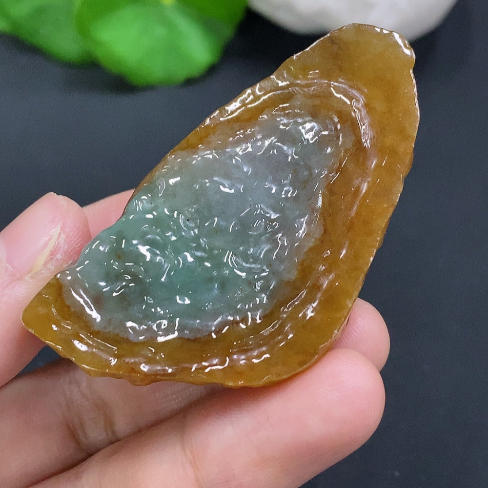 Natural jade gemstone in a neutral color, featuring smooth, polished surface with subtle variations, from HUILIU HQ.
