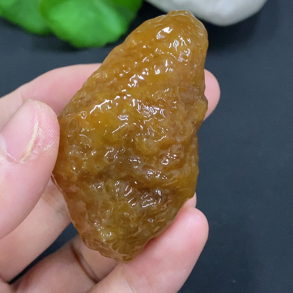 HUILIU HQ Jade jewelry piece with an undetermined color origin, showcasing smooth, polished jade stone.