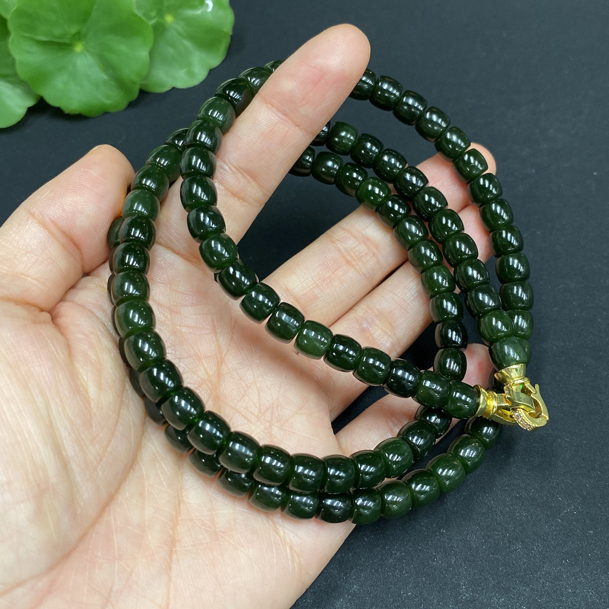 Huiliu certified Hetian jade bead necklace with 6.6mm non-inlaid jade beads, showcasing smooth, polished green jade strands.