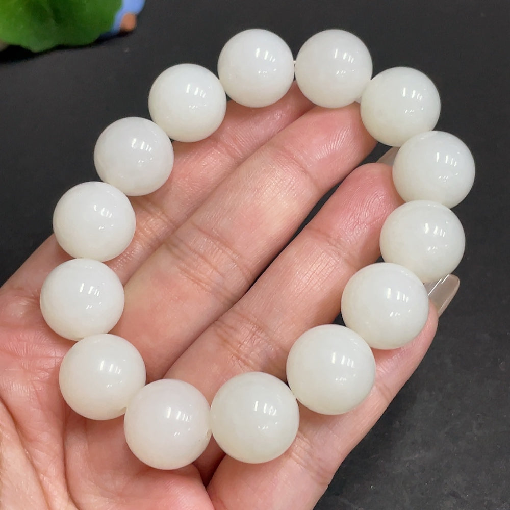 Huiliu Certified Hetian Jade Bracelet, 14.9mm, showcasing smooth, polished jade beads on a natural jewelry design.