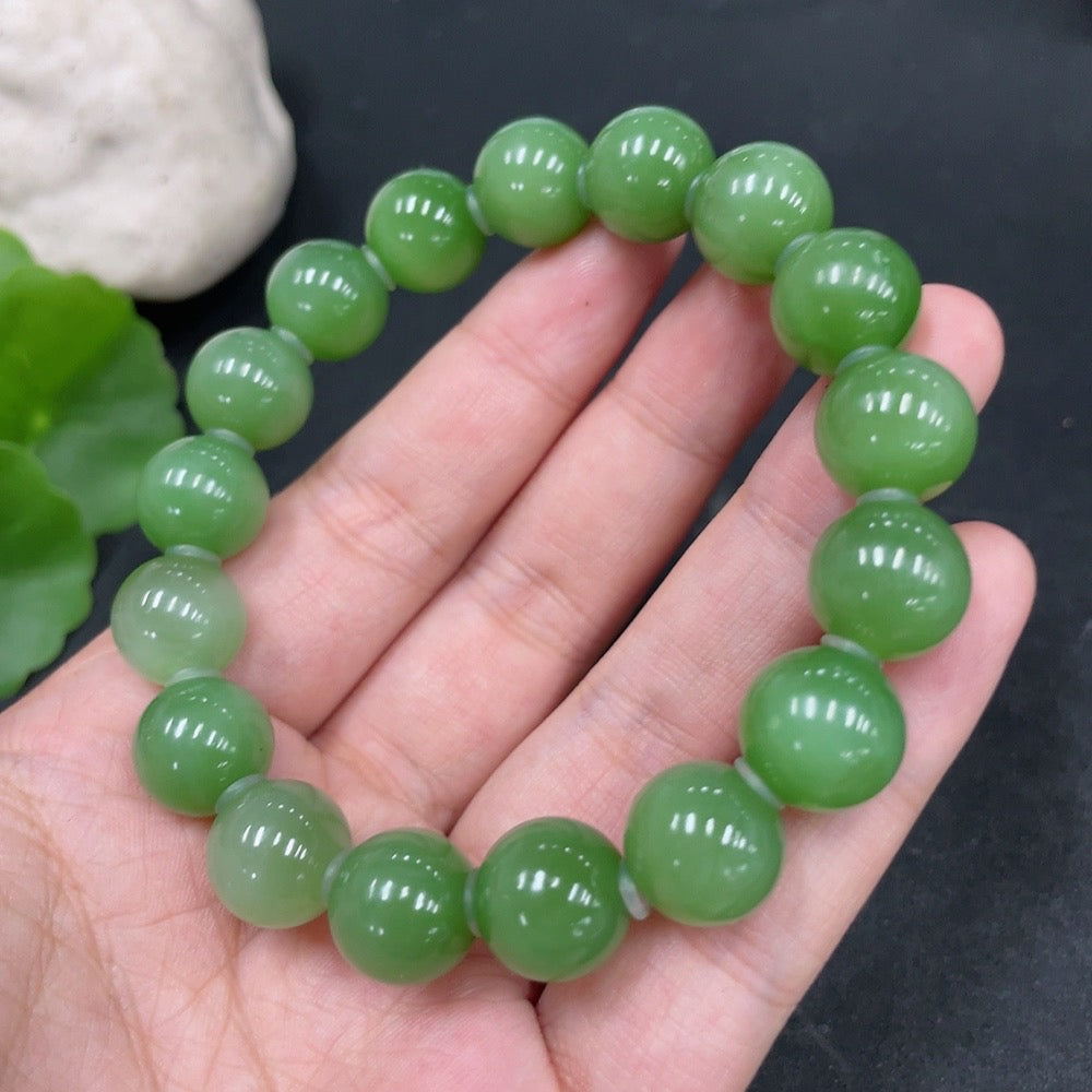 Hetian jade bracelet by HUILIU HQ, about 11.6mm wide, total weight 45.8g, showcasing smooth jade beads on a string.