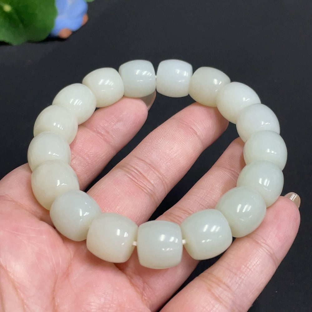 Hetian Jade bracelet by HUILIU HQ featuring 12.5 mm jade beads, weighing approximately 62.9 grams, showcasing natural green jade stones.