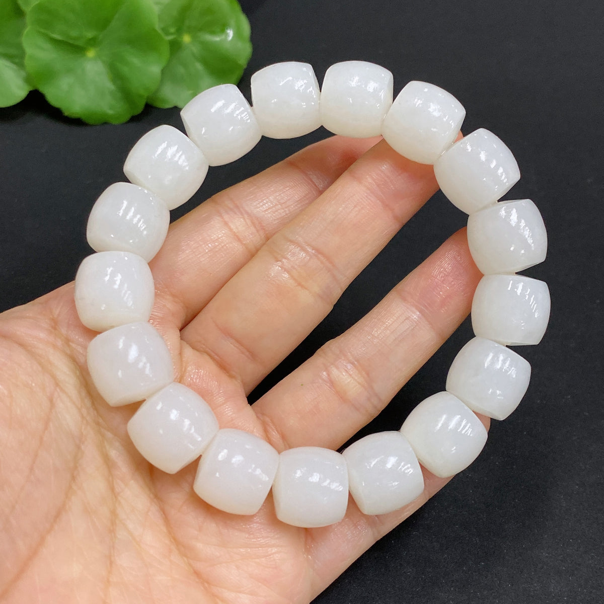 Hetian Jade bracelet with 12.7mm beads, crafted by HUILIU HQ, showcasing smooth, polished jade stones and a substantial weight.