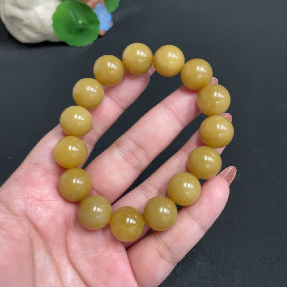 Hetian Jade bracelet by HUILIU HQ featuring 13.6 mm beads and a total weight of 61.7g, showcasing smooth, polished jade stones.