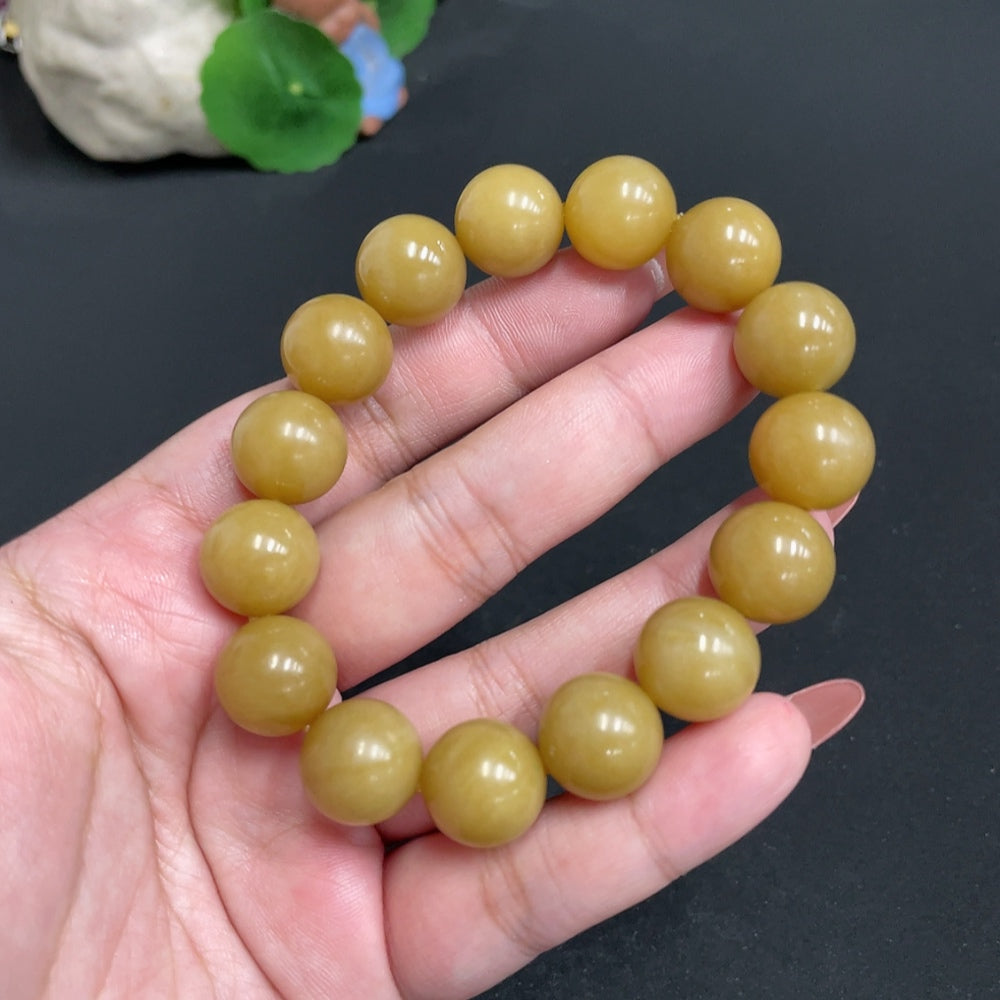 Huiliu HQ Hetian Jade bracelet with 13.6 mm beads, showing smooth, polished green jade stones and a secure clasp.