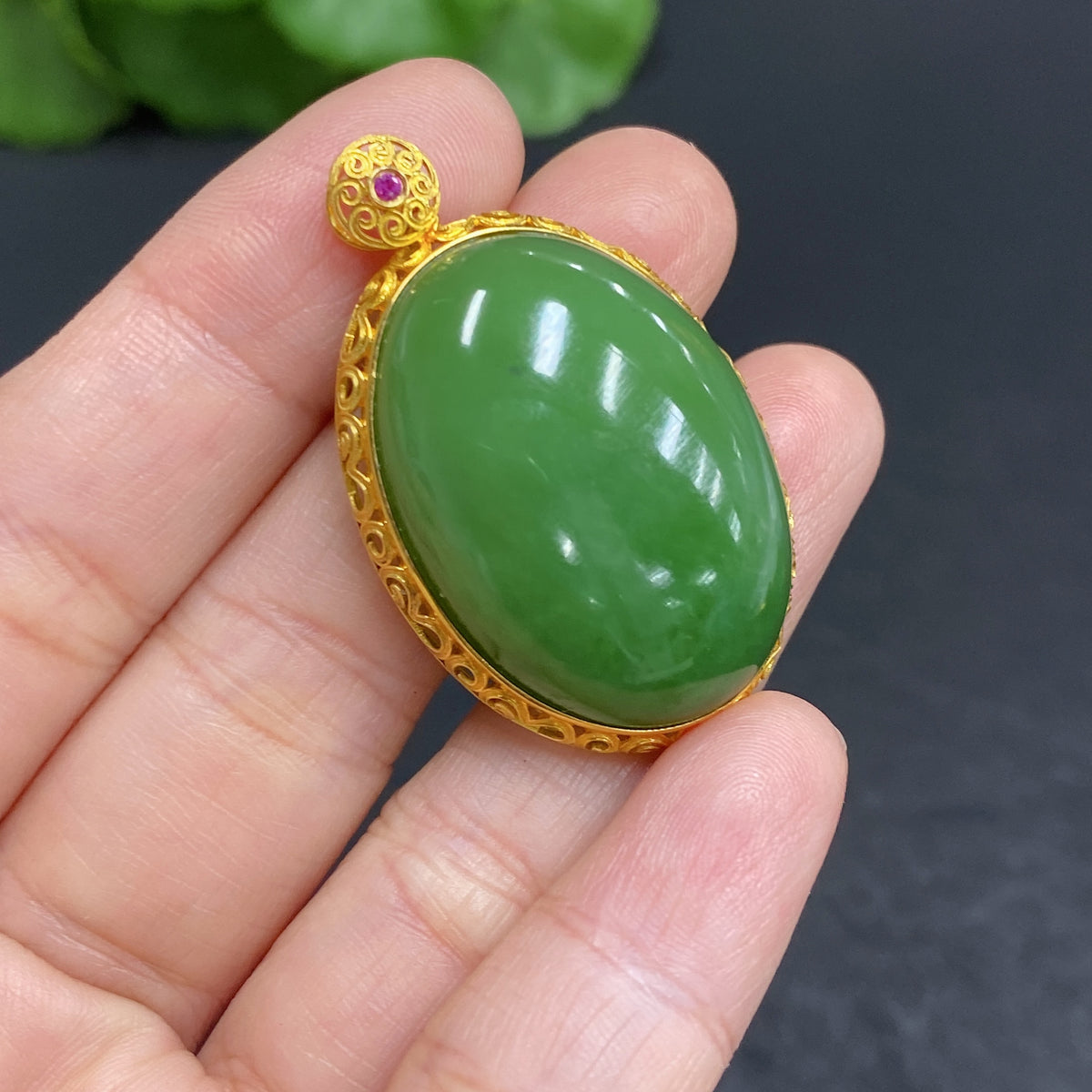 Hetian Jade cabochon pendant set in 18k gold, crafted by HUILIU HQ, featuring a smooth, polished jade stone with gold setting.