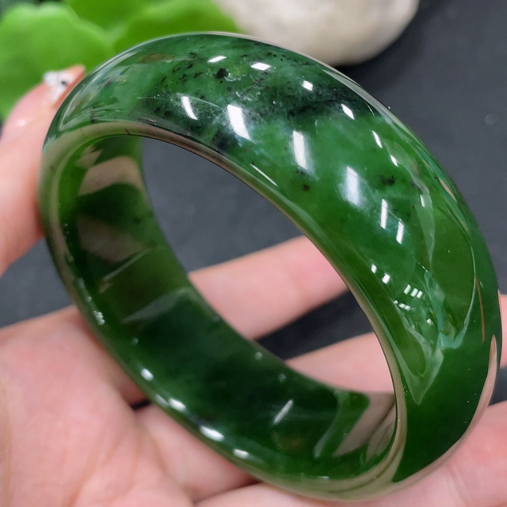 Huiliu Certified Hetian Jade green round bracelet showcasing smooth polished jade beads on a string.