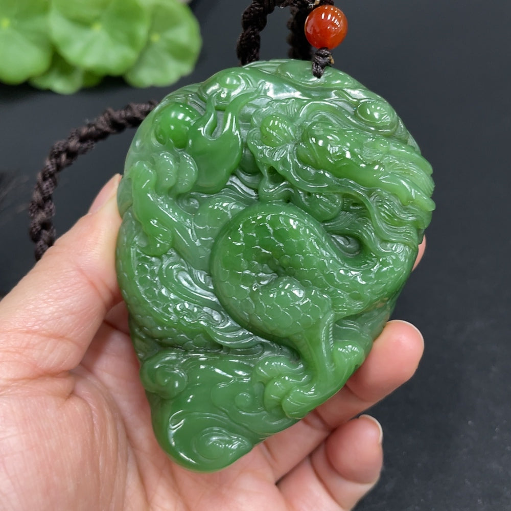 Huiliu Certified Hetian Jade hand-carved bi jade dragon, detailed craftsmanship, traditional Chinese jade sculpture.