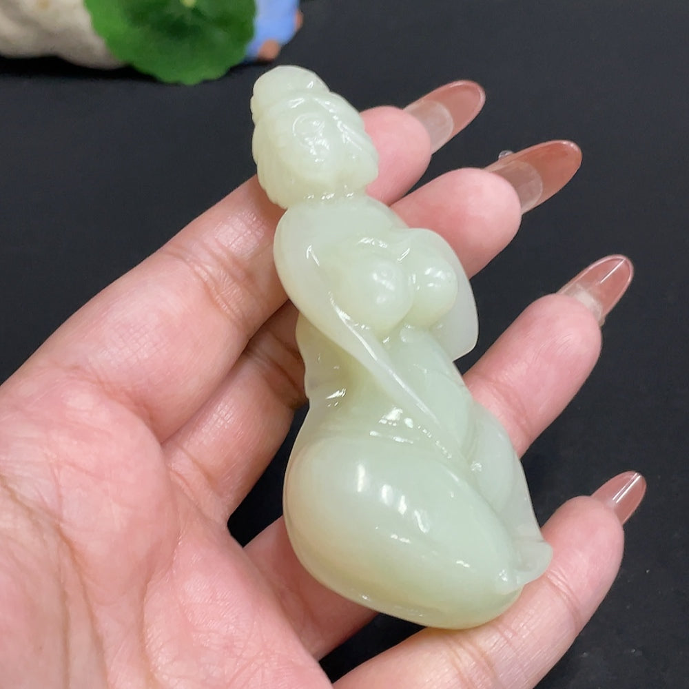 Huiliu HQ Hetian jade handheld piece with intricate carvings, weighing approximately 76.4g, showcasing traditional craftsmanship.