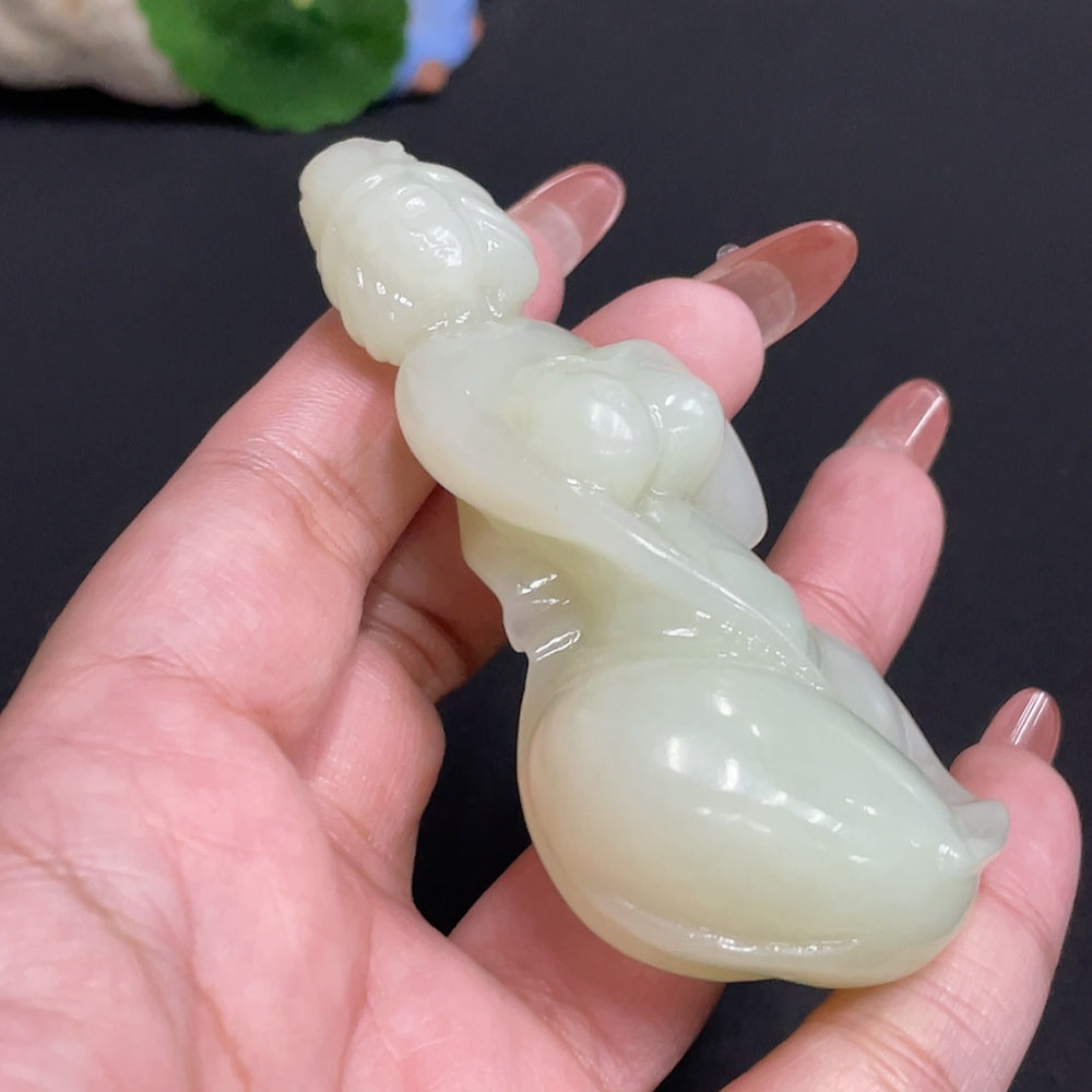 Huiliu HQ Hetian Jade handheld piece, smooth green jade with intricate carvings, weighing approximately 76.4g, showcasing traditional craftsmanship.