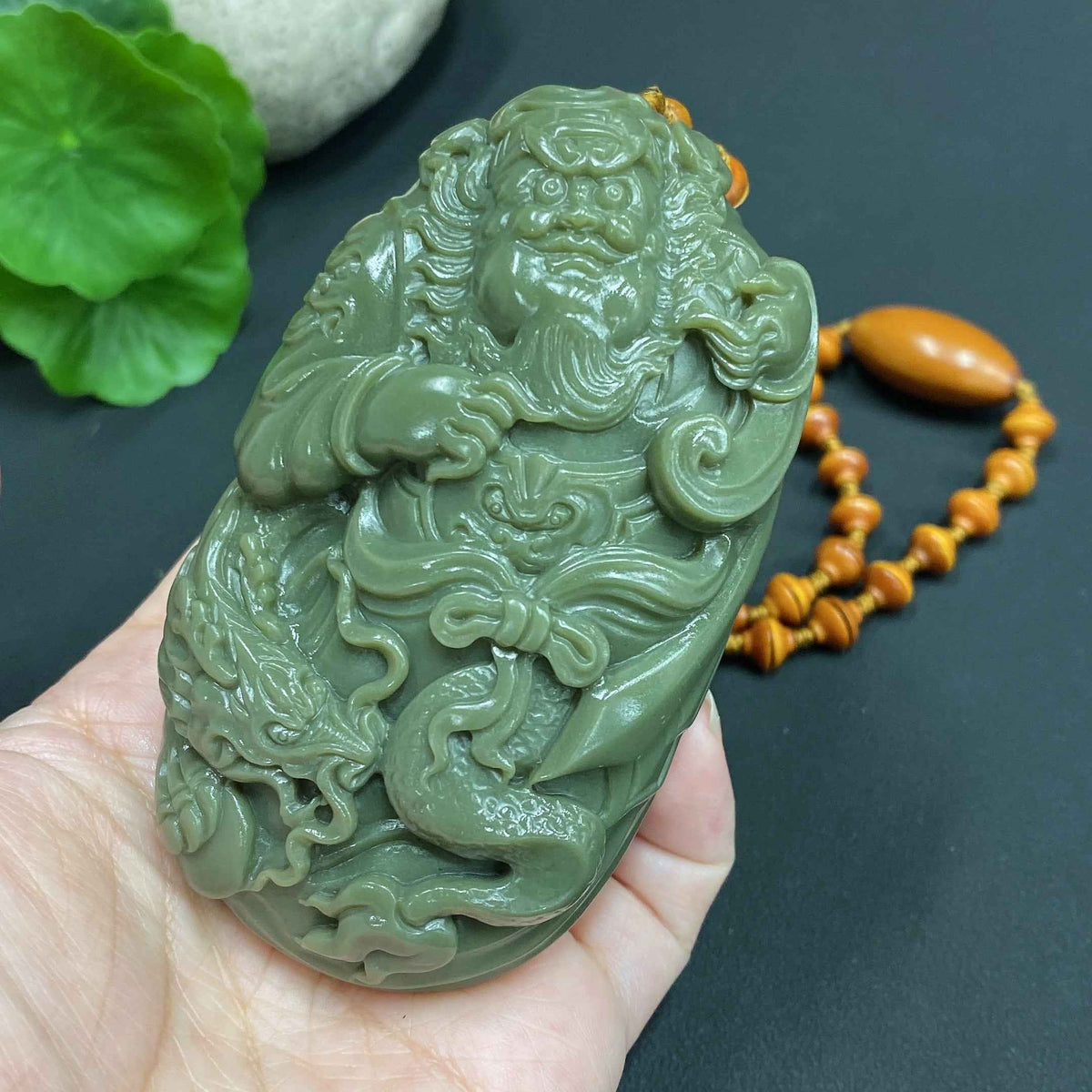 Huiliu HQ Hetian Jade handheld Zhong Kui figure, Huiliu certified, showcasing detailed craftsmanship and smooth jade surface.
