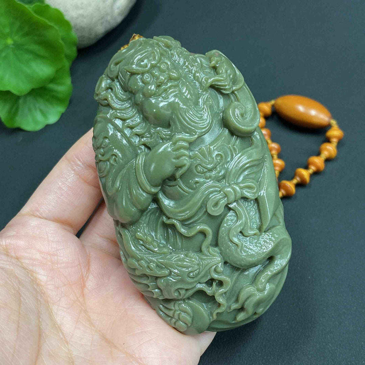 Huiliu HQ Hetian jade handheld Zhong Kui figure, Huiliu certified, intricately carved jade sculpture with detailed features.
