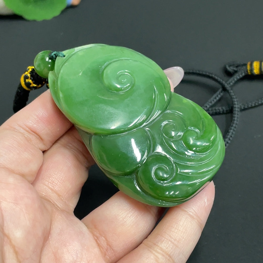 Huiliu certified Hetian jade Jasper pendant featuring Zhong Kui design, showcasing smooth polished surface and intricate details.