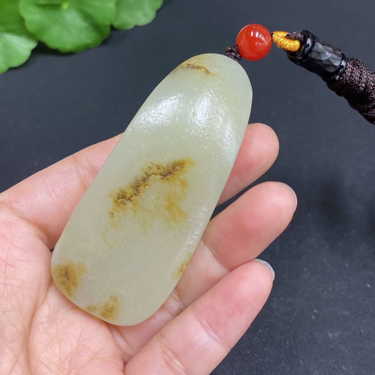 Hetian jade pendant featuring Amitabha Buddha, crafted by HUILIU HQ, showcasing intricate jade carving and spiritual symbolism.