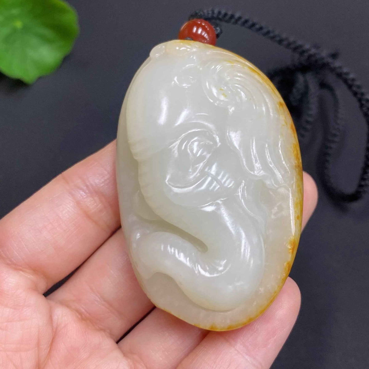 Huiliu HQ Hetian Jade Pendant with auspicious design, undetermined skin color, including rope, weighs approximately 85.7g.