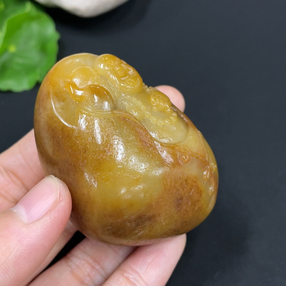 Huiliu HQ Hetian Jade Buddha pendant featuring a carved jade statue with undetermined skin color, certified Huiliu Jade craftsmanship