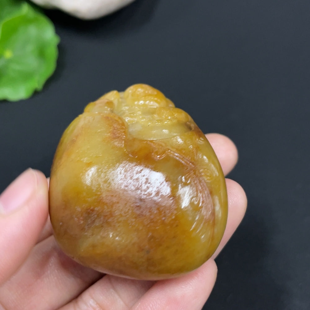 Huiliu HQ Hetian Jade Buddha pendant with undetermined skin color, crafted from green jade, featuring a detailed Buddha statue design.