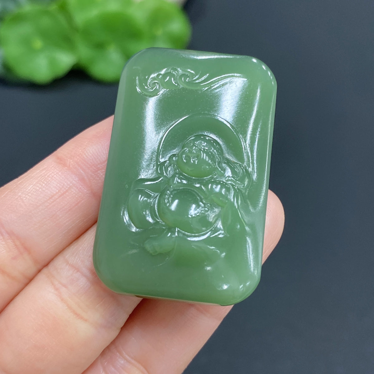 Hetian Jade Buddha pendant by HUILIU HQ, weighs approx. 24.5g, featuring a detailed carved Buddha figure on smooth jade.