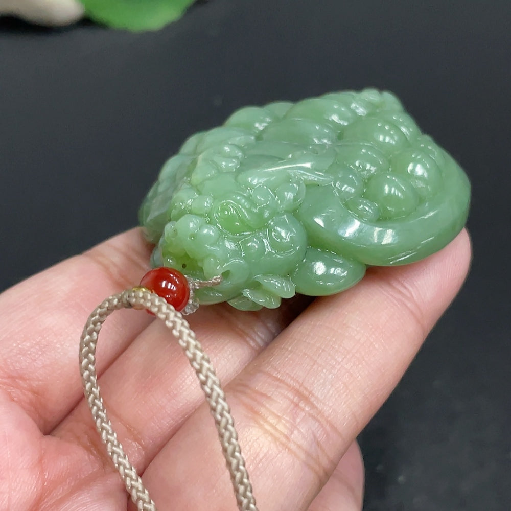Hetian jade pendant featuring a dragon turtle design, weighing approximately 67.5g, with a rope for wearing, by HUILIU HQ.