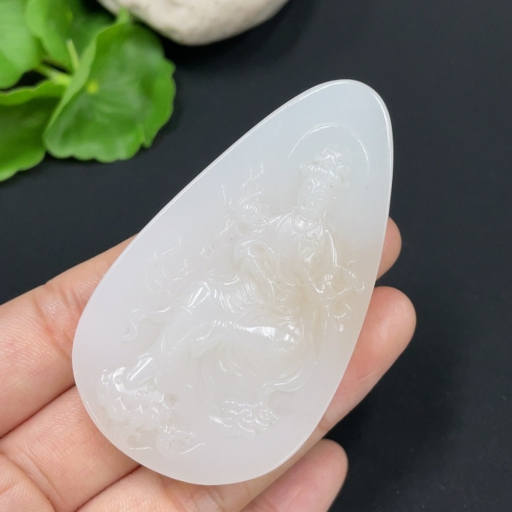 Huiliu certified Hetian jade pendant featuring Guanyin figure, smooth polished surface, and intricate carved details.