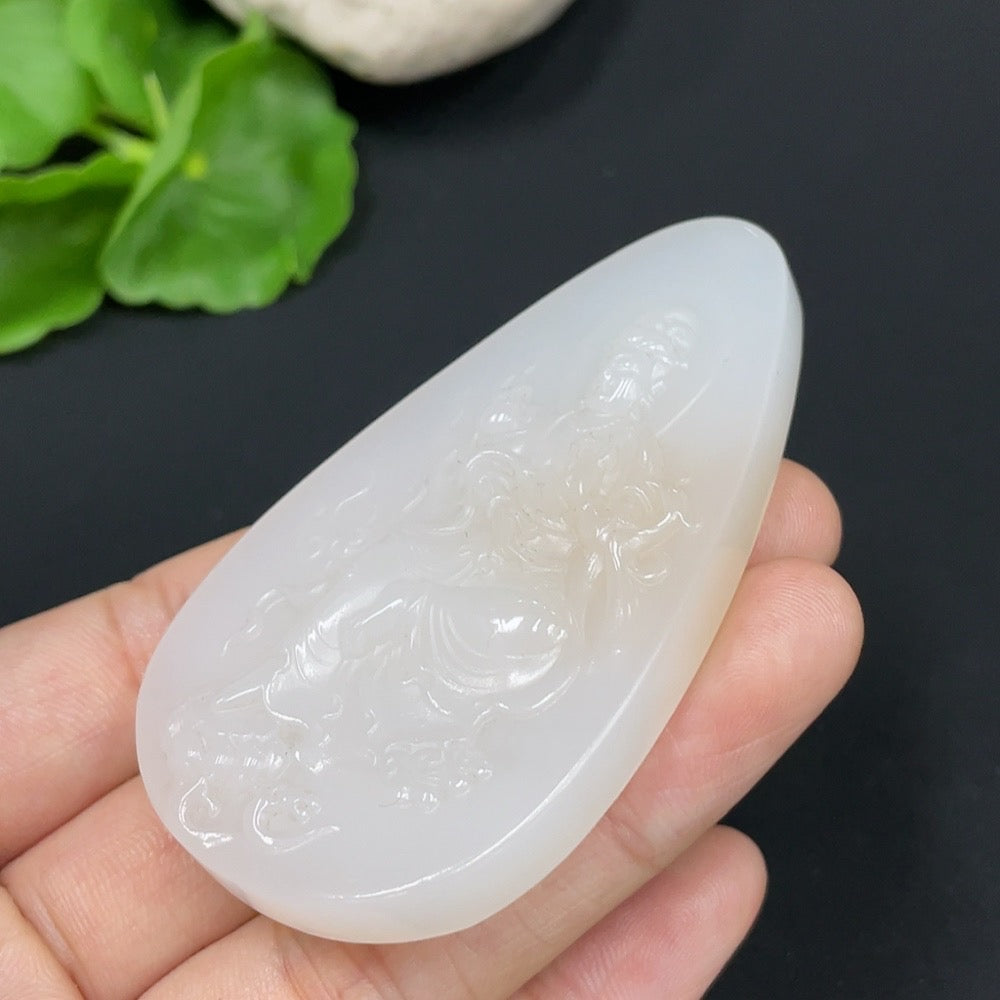 Huiliu Certified Hetian Jade Pendant featuring Guanyin design, intricately carved jade pendant with detailed craftsmanship.