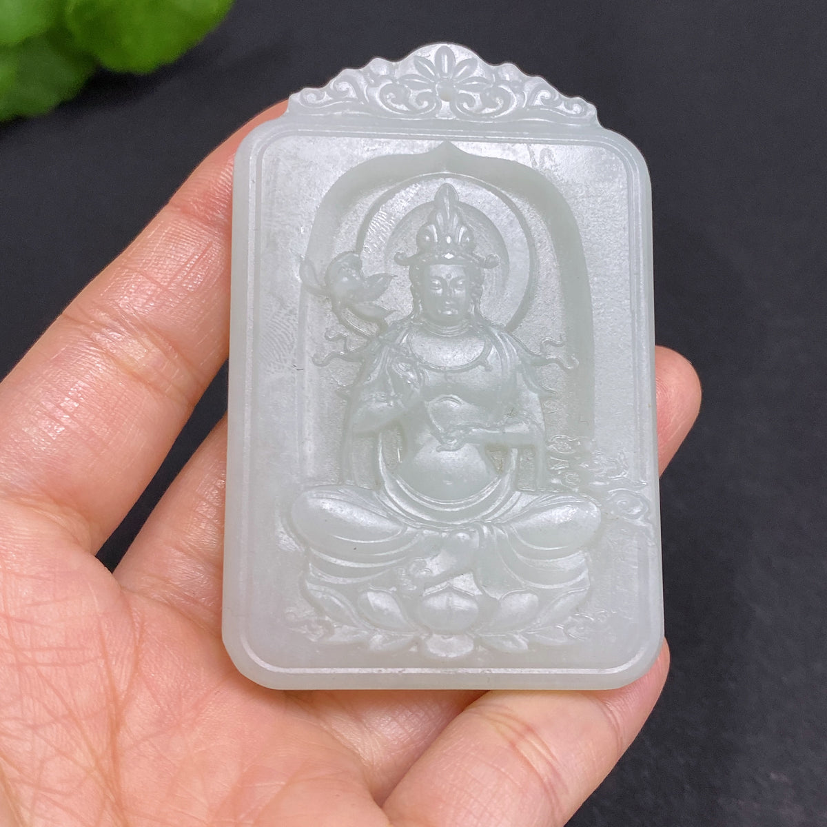 Huiliu Certified Hetian jade pendant featuring Guanyin figure, traditional craftsmanship, smooth polished surface, and intricate details.