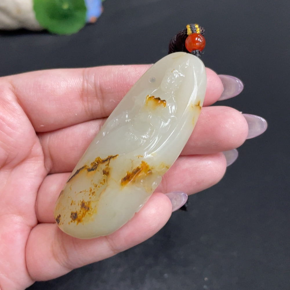 Hetian Jade Pendant featuring Guanyin, crafted by HUILIU HQ, showcasing intricate carving of the Buddhist deity on smooth jade.