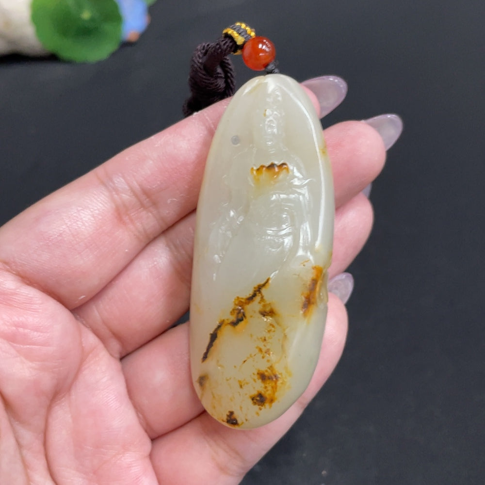 Hetian jade pendant featuring Guanyin, crafted by HUILIU HQ, showcasing intricate carvings symbolizing blessings and compassion.