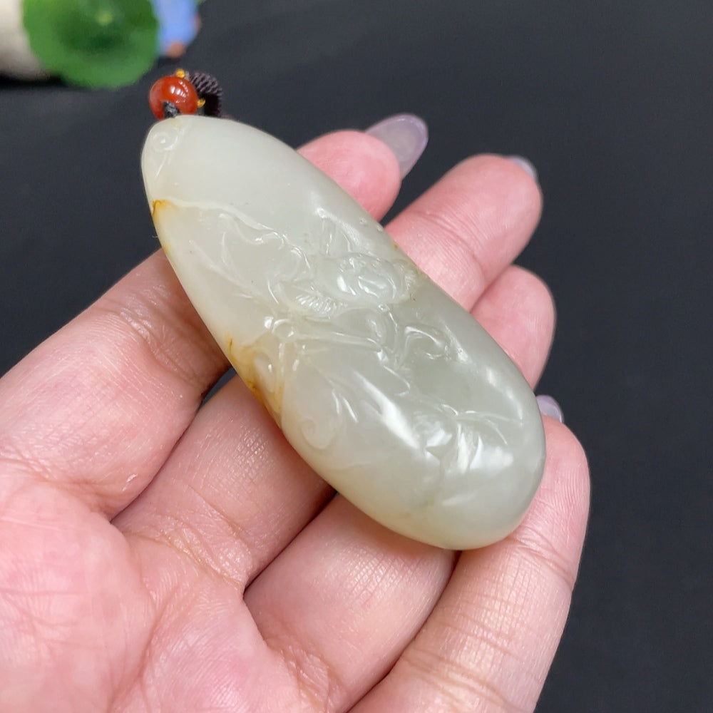 Hetian jade pendant featuring Guanyin, symbolizing blessings, crafted by HUILIU HQ with intricate design and smooth finish.