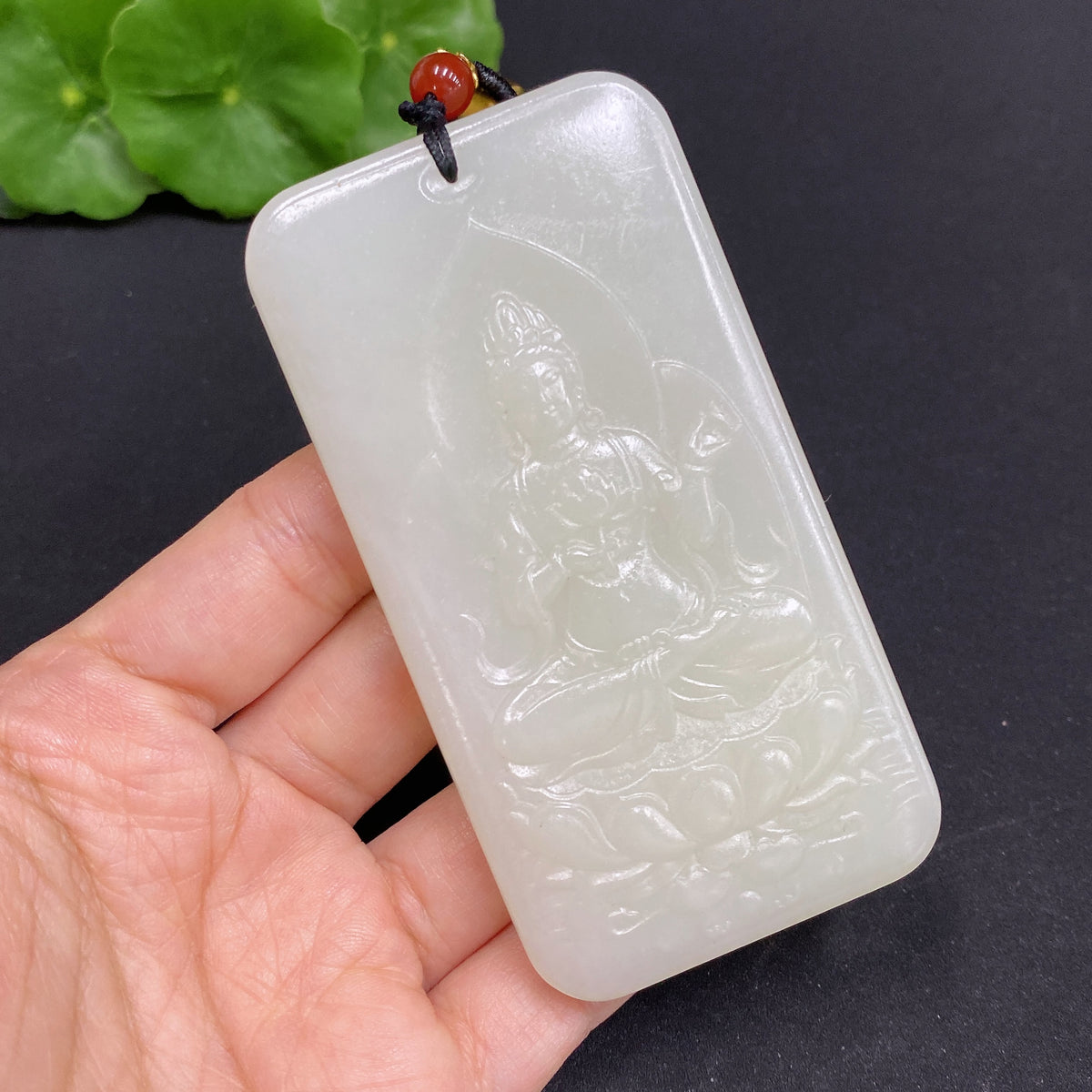 Huiliu certified Hetian jade Guanyin pendant with rope, showcasing smooth, polished green jade craftsmanship.