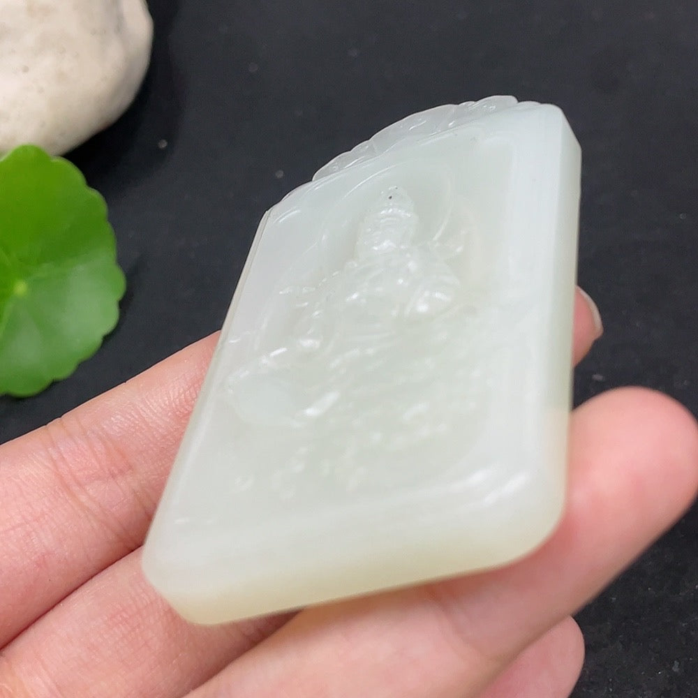 Huiliu Certified Hetian Jade Pendant featuring Guanyin figure, smooth polished jade with intricate carving, hanging on a silk cord.