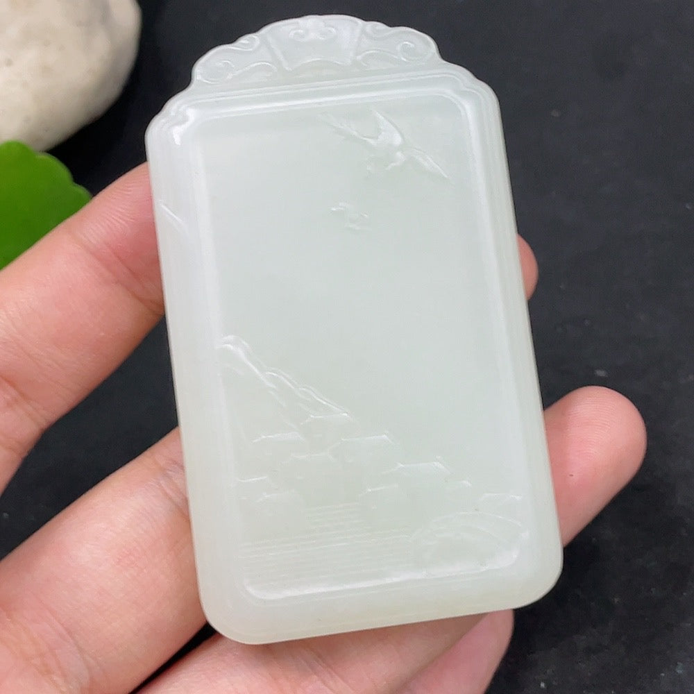 Huiliu Certified Hetian Jade Pendant featuring Guanyin figure, smooth green jade carving, and intricate details.