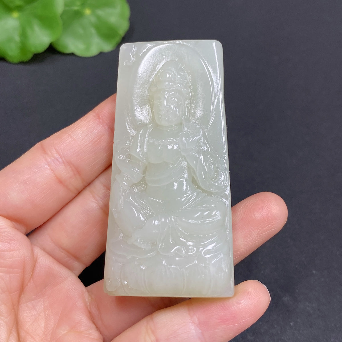Huiliu certified Hetian jade pendant featuring Guanyin, intricate carved jade pendant with detailed figure design.