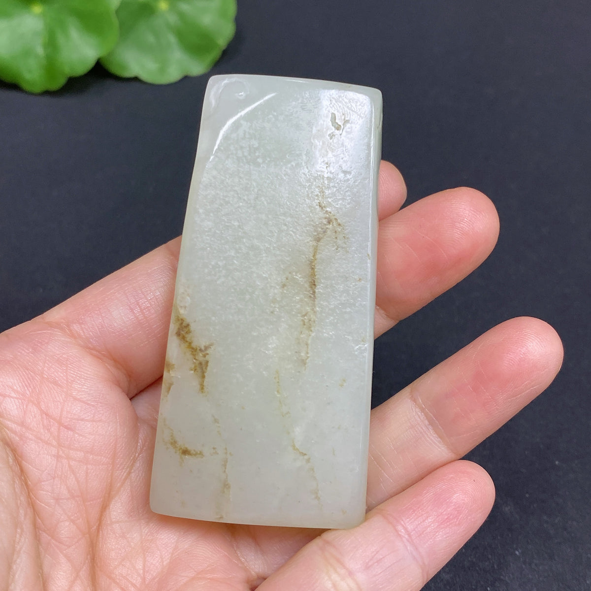 Huiliu Certified Hetian Jade Pendant featuring Guanyin figure, intricately carved in smooth, polished jade.
