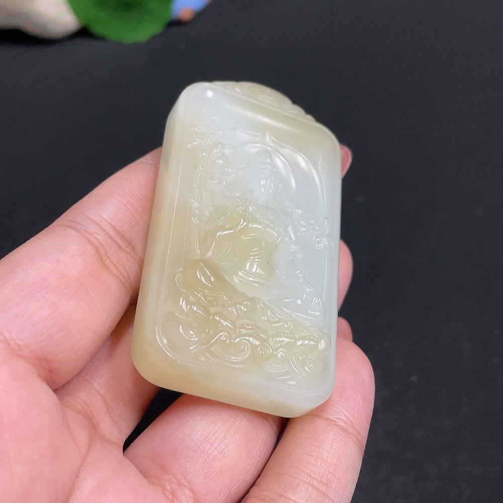 Huiliu certified Hetian jade pendant featuring Guanyin figure, smooth polished surface, and intricate carved details.