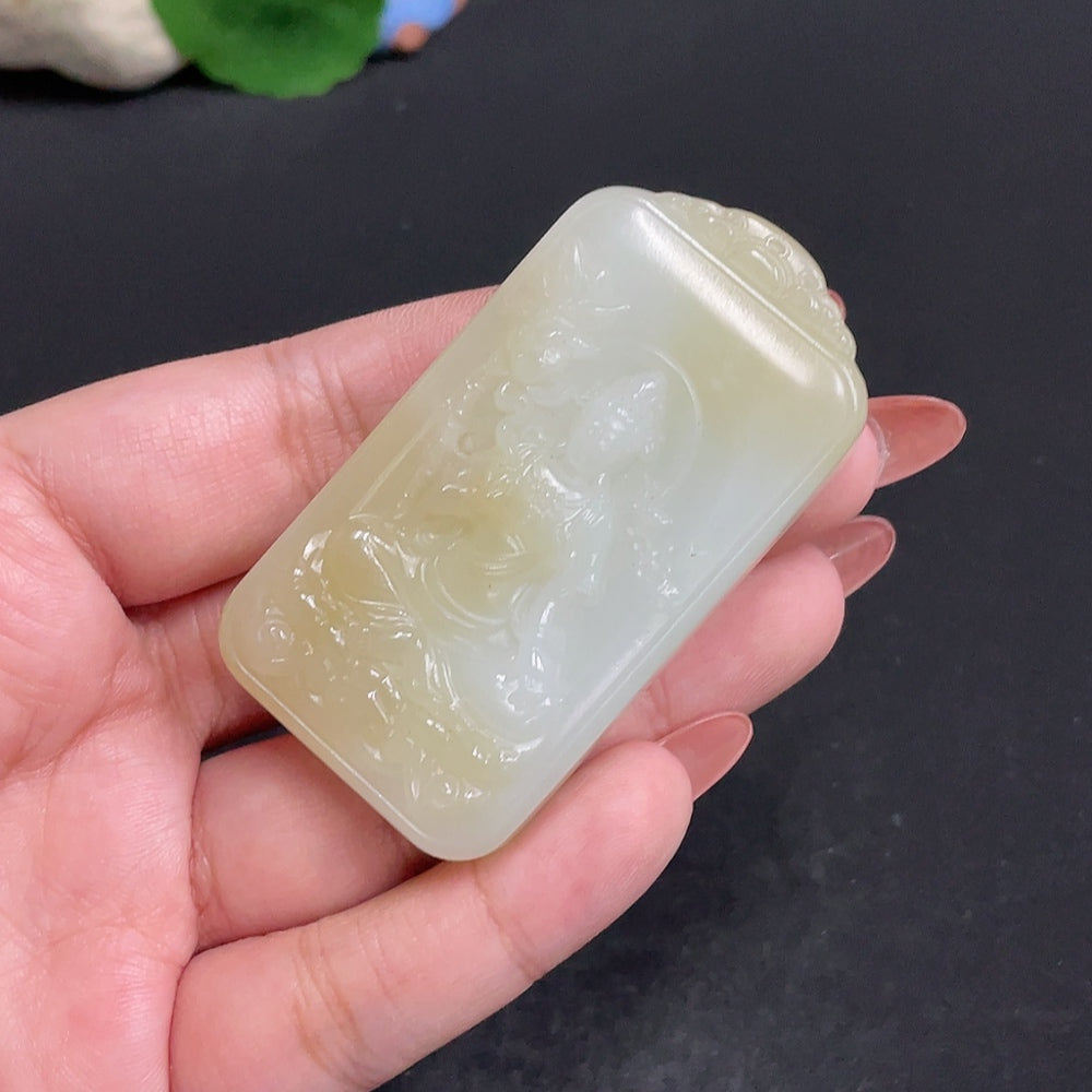 Huiliu certified Hetian jade pendant featuring Guanyin deity, smooth polished jade with intricate carving details.