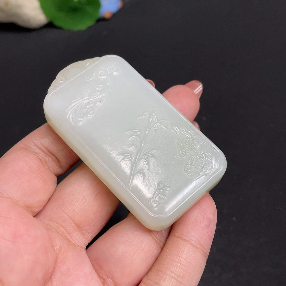 Huiliu Certified Hetian Jade Pendant featuring Guanyin figure, smooth polished surface, and intricate carved details.