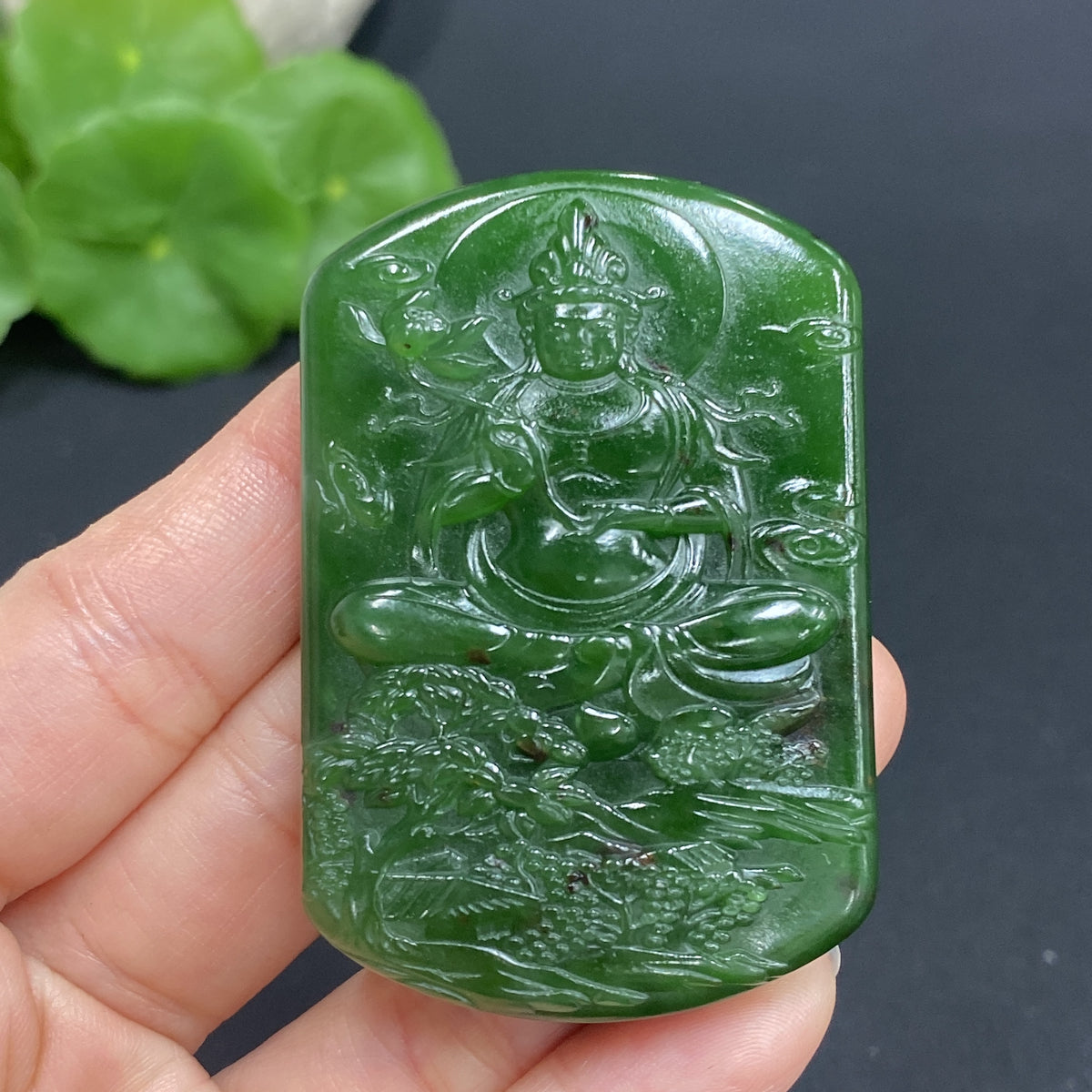 Huiliu HQ Hetian jade pendant featuring Guanyin figure, weighing approximately 52g, crafted from smooth green jade.