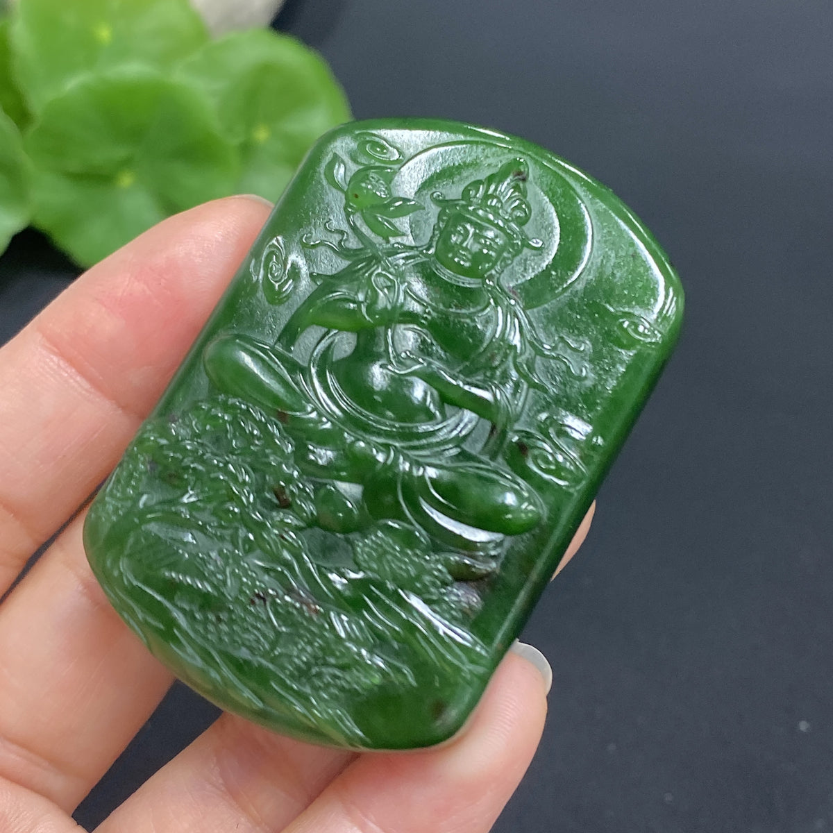 Hetian jade Guanyin pendant from HUILIU HQ, carved with intricate details, weighs about 52g, showcasing traditional craftsmanship.