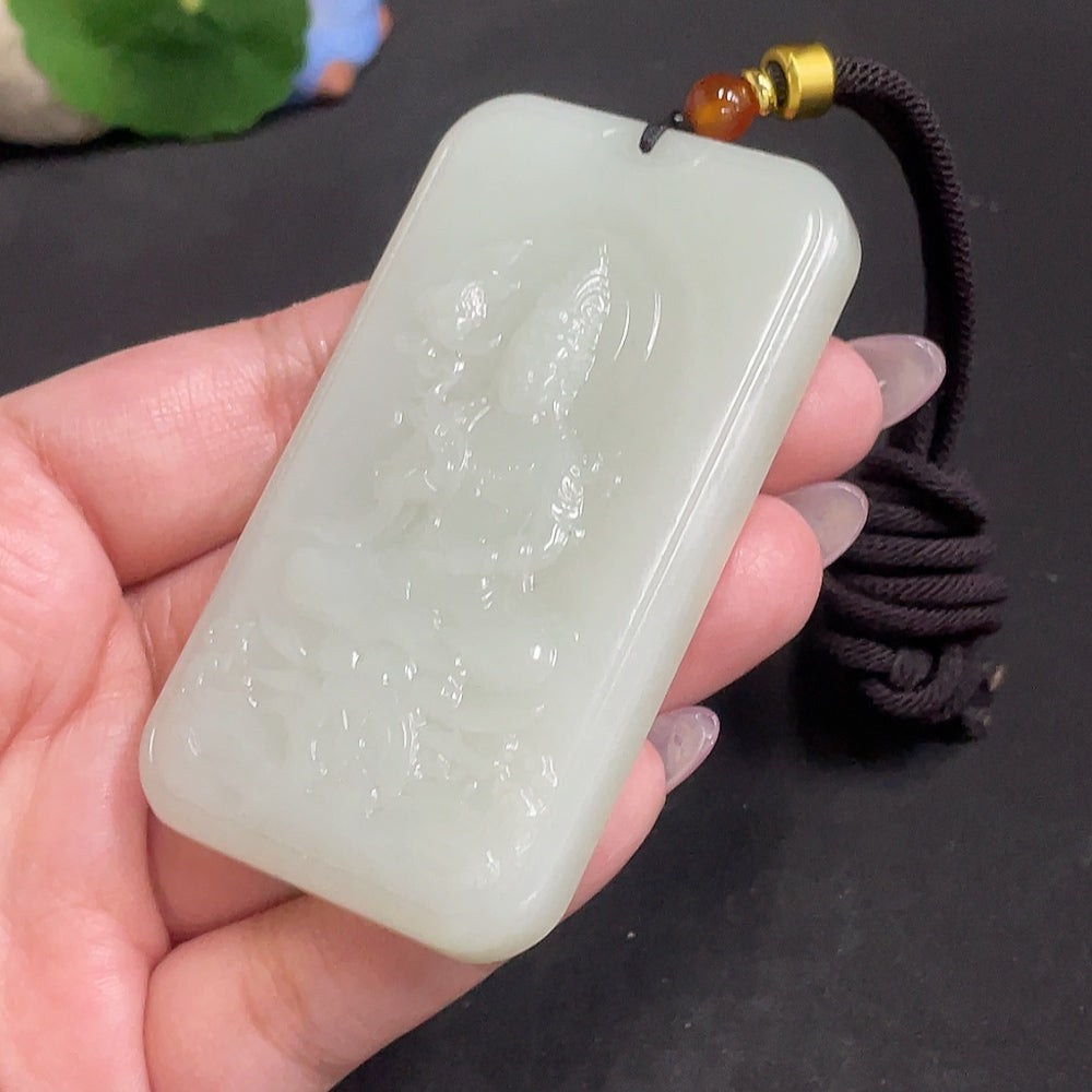 Huiliu certified Hetian jade Guanyin pendant with rope, featuring intricate carvings and smooth polished surface.