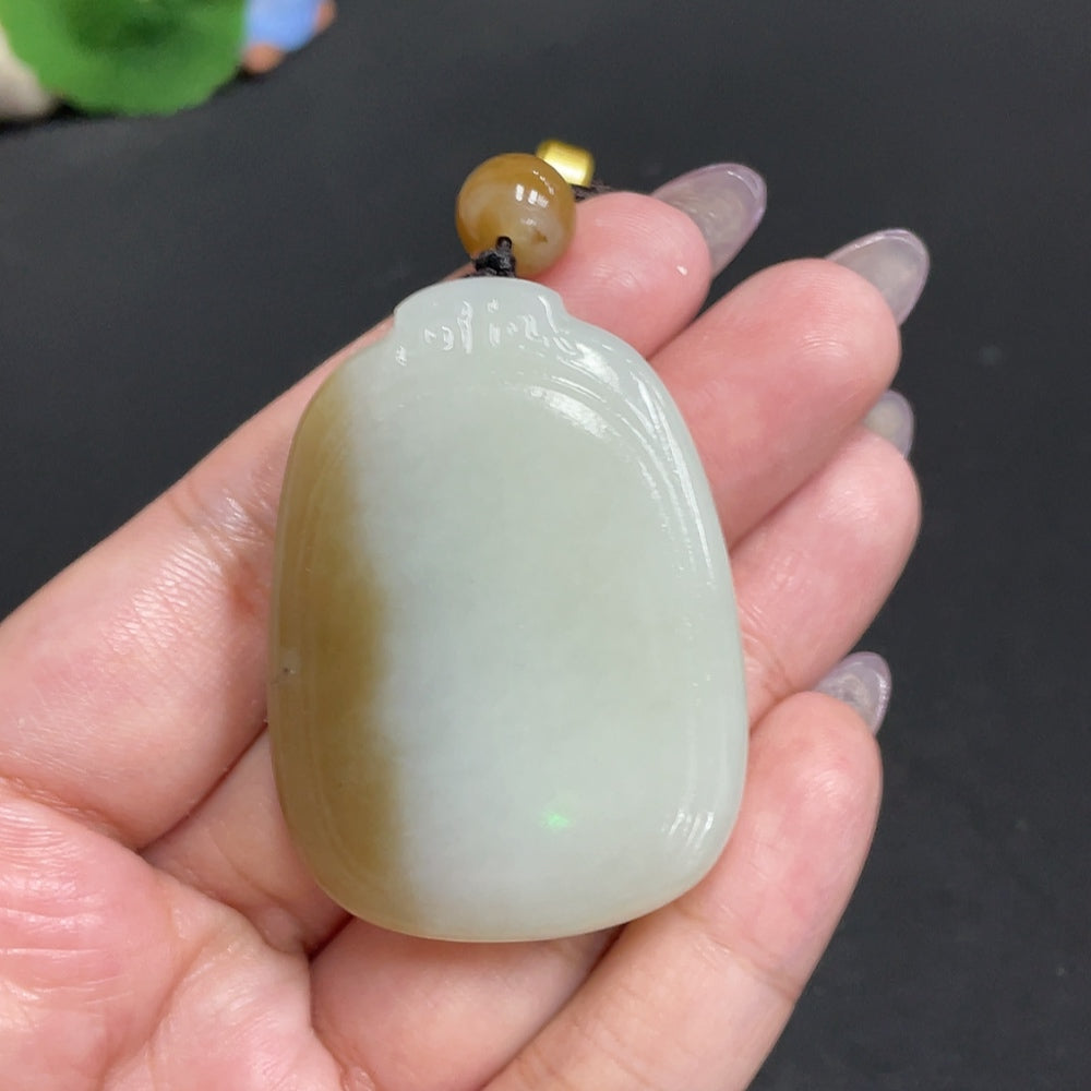Huiliu certified Hetian jade pendant featuring a plain, smooth jade stone with natural green hues and polished finish.