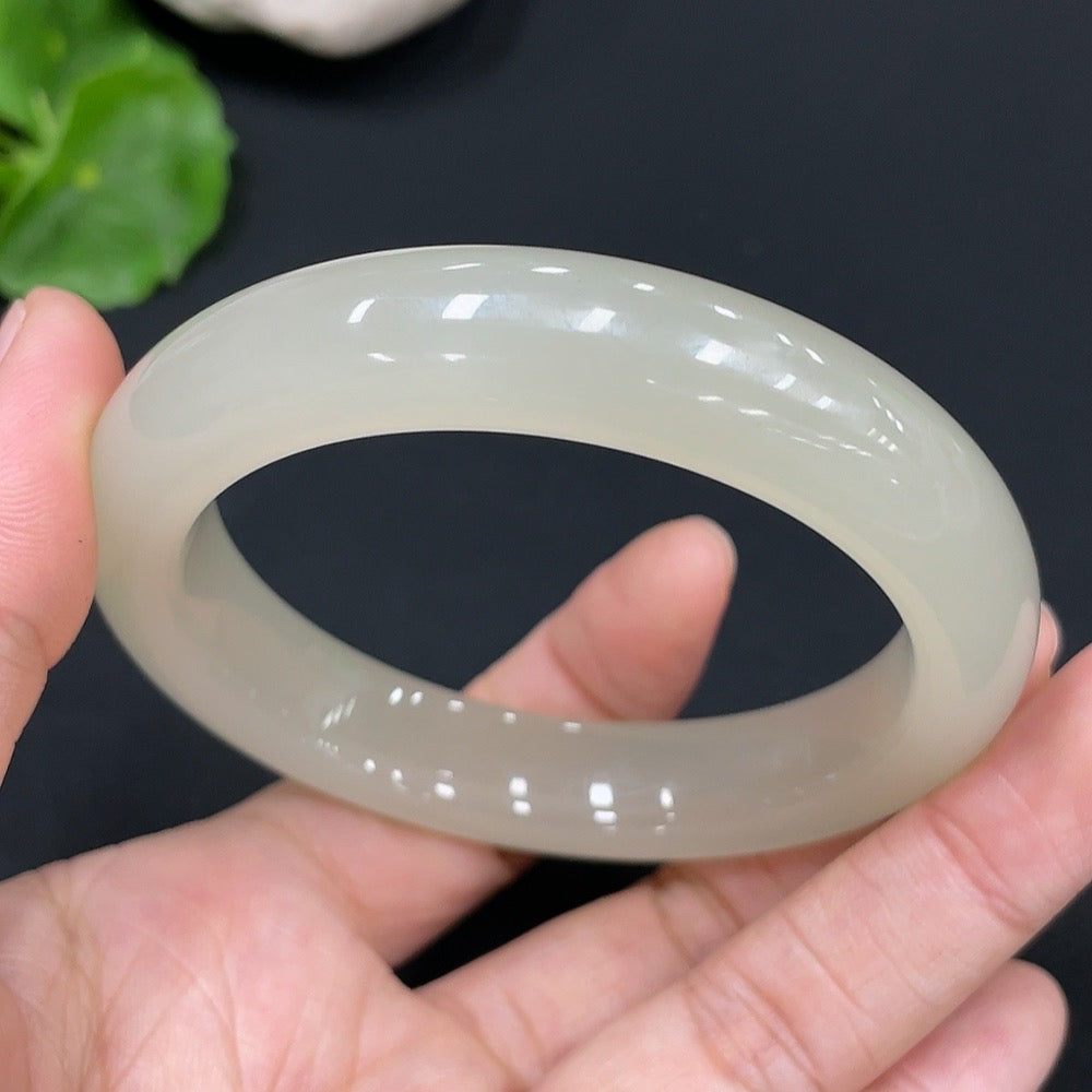 Huiliu Certified Hetian Jade Round Bracelet featuring smooth, polished jade beads on a delicate string.